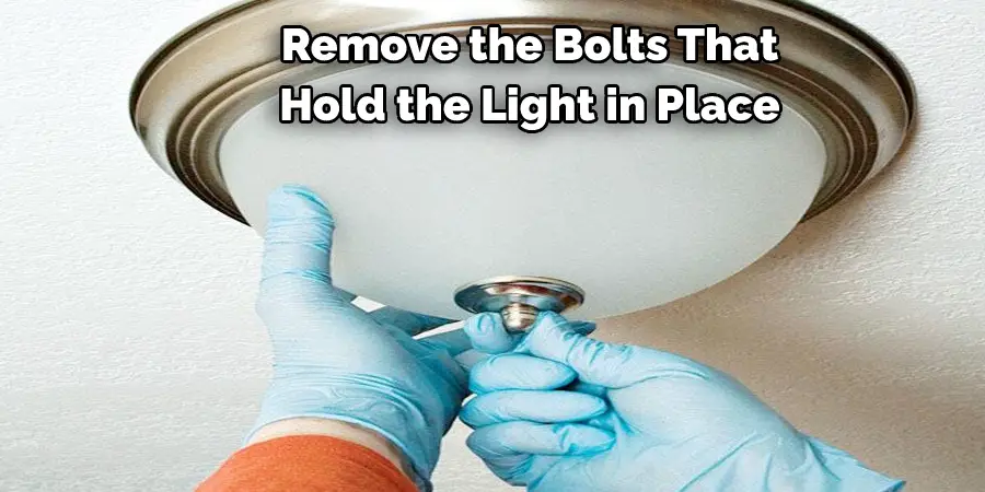  Remove the Bolts That  Hold the Light in Place