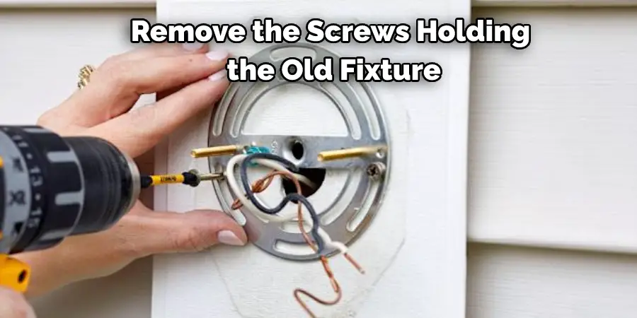 Remove the Screws Holding the Old Fixture