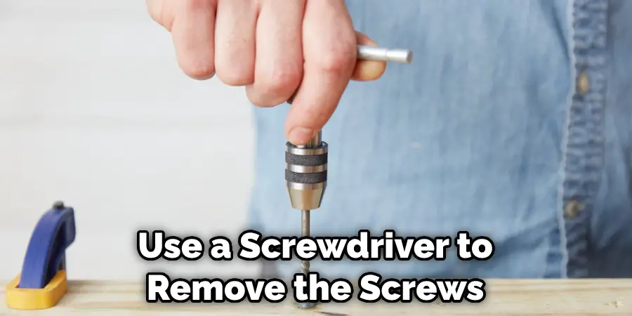 Use a Screwdriver to Remove the Screws