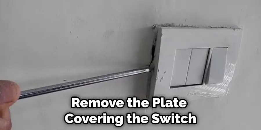 Remove the Plate Covering the Switch