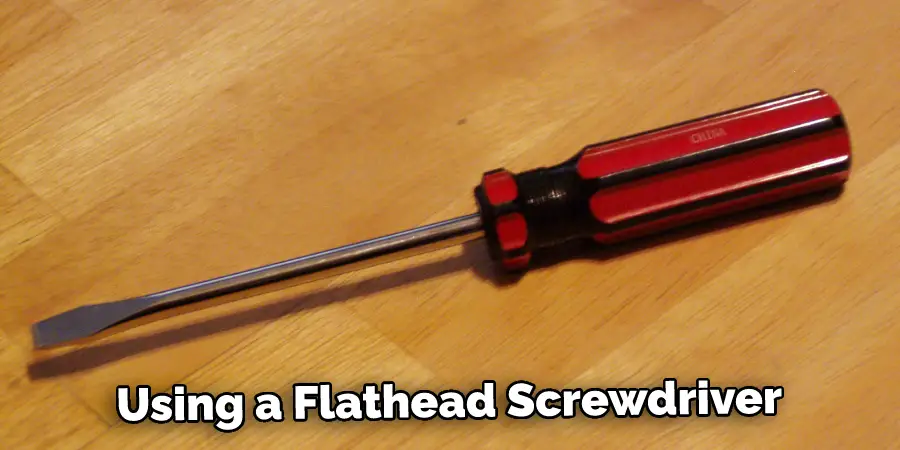 Using a Flathead Screwdriver