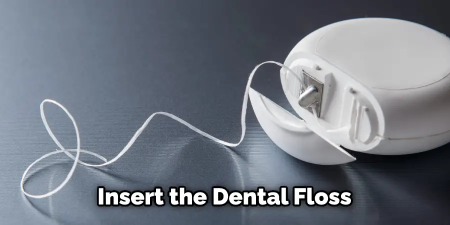 Insert the Dental Floss