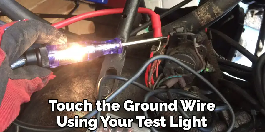 Touch the Ground Wire Using Your Test Light 