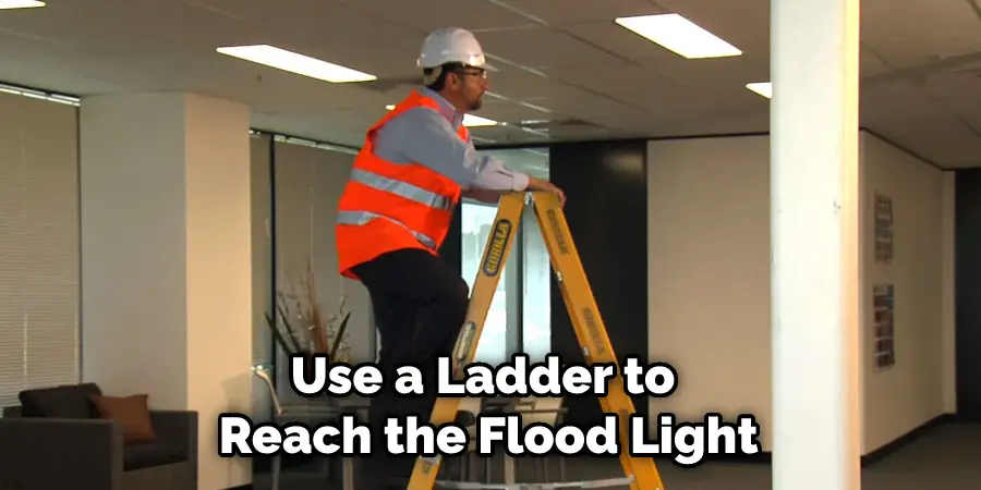 Use a Ladder to Reach the Flood Light