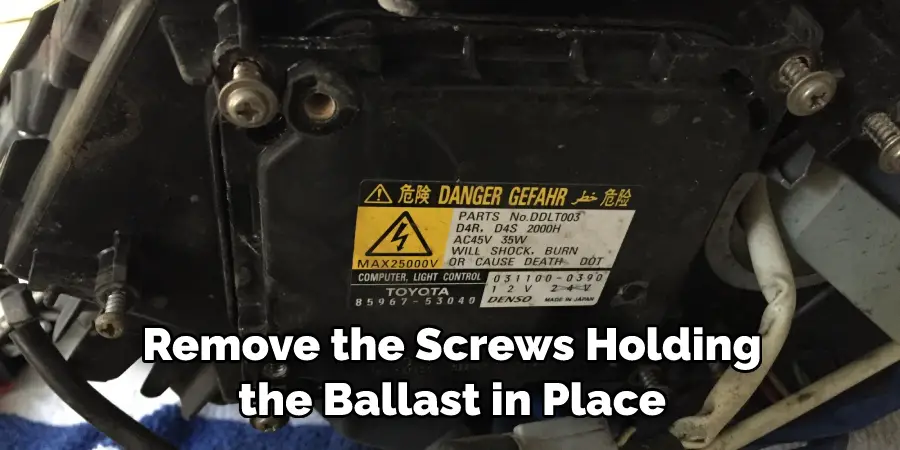 Remove the Screws Holding the Ballast in Place
