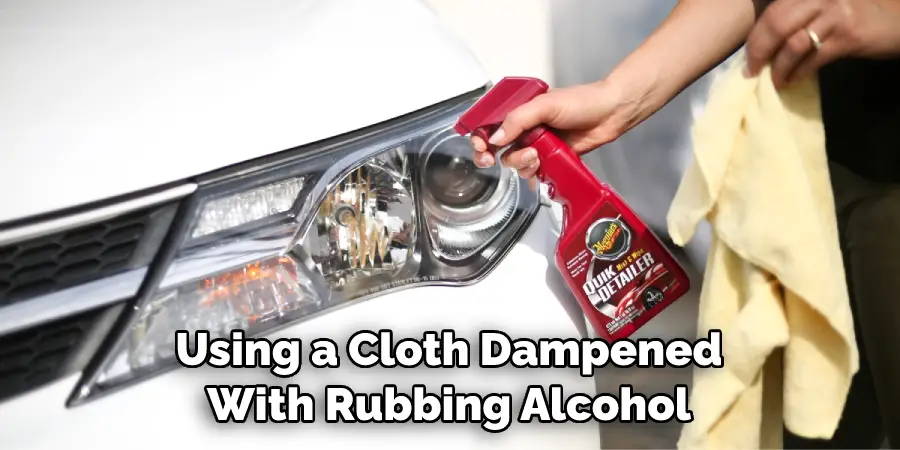 Using a Cloth Dampened With Rubbing Alcohol